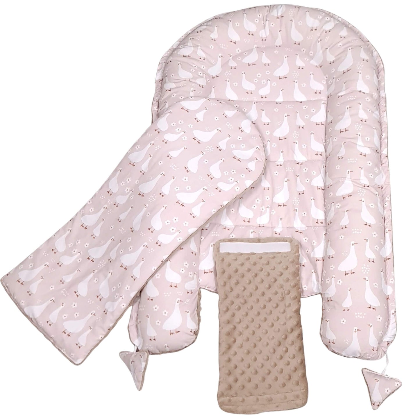 Evcushy baby nest showing removable padded mattress liner and safety band for securing cords