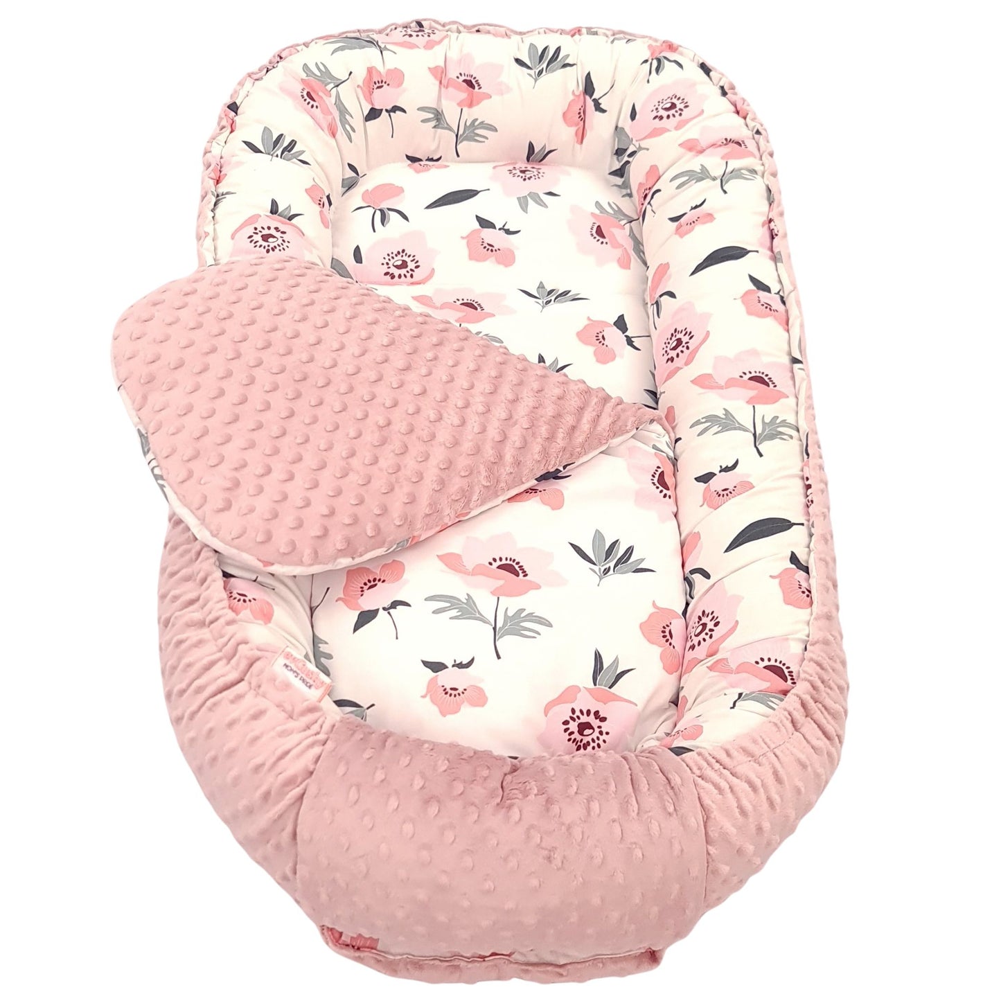 Close-up of poppy flowers cotton fabric and soft blush pink dimple plush nest junior size up to 36 months sleeping pod with liner