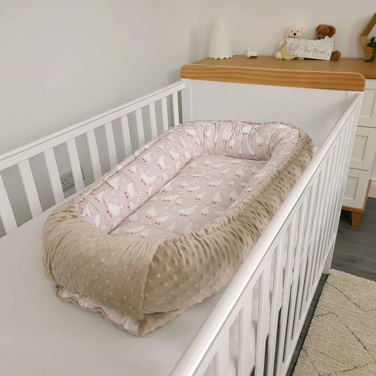evCushy baby nest sleep pod XXL in the cot bed geese pattern with taupe cosy plush base