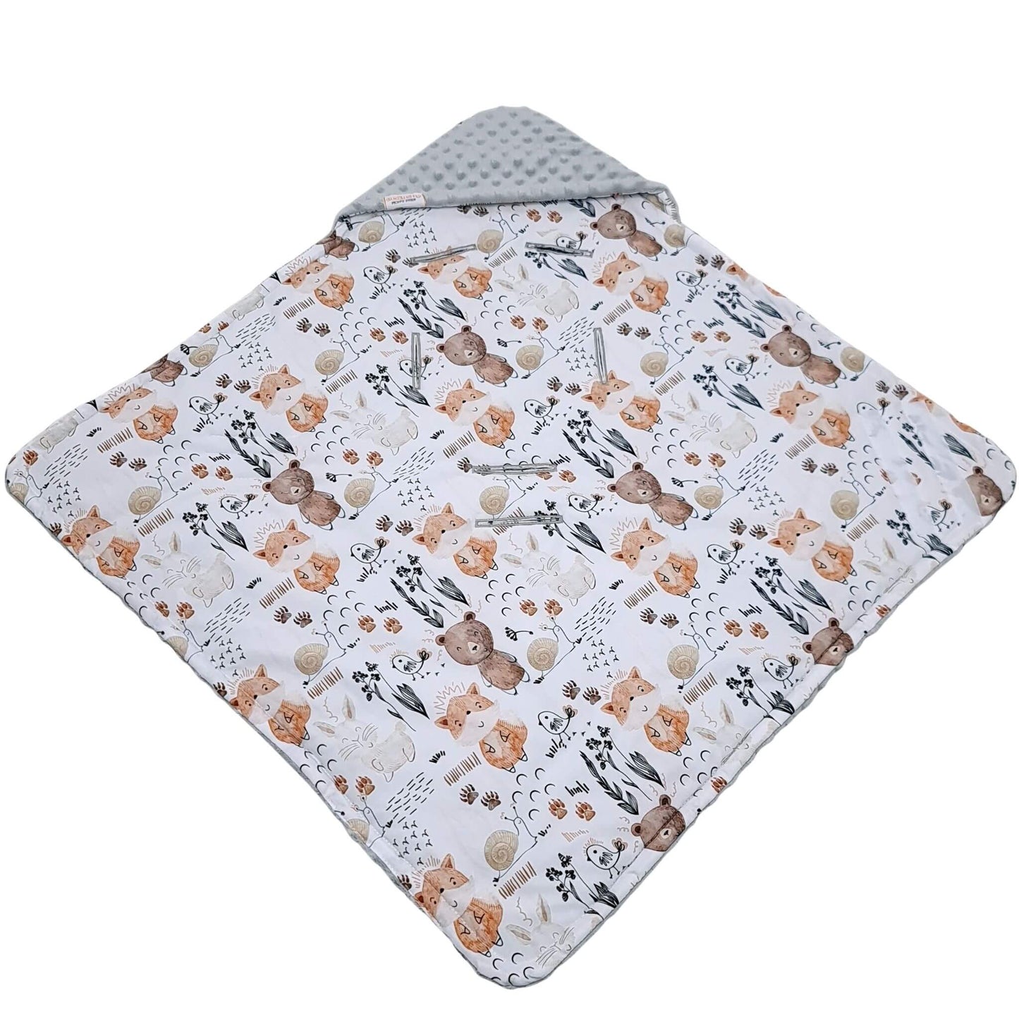 Baby blanket with teddy bear and floral pattern on a white background