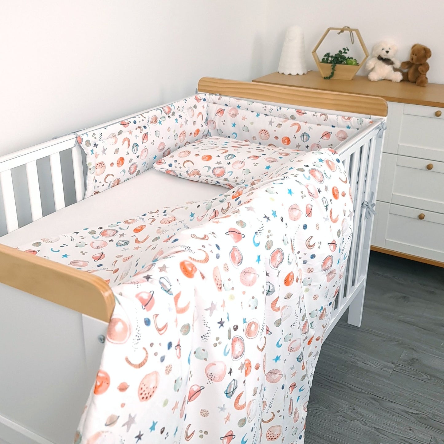 evcushy nursery setting with white cot bed space patterned crib rungs protector pillow and duvet for toddler