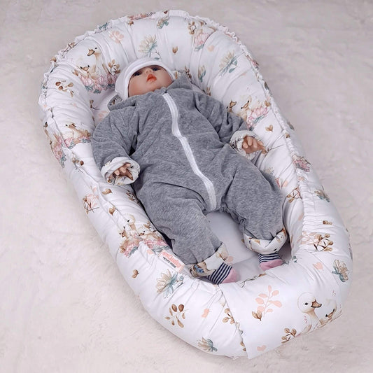 Newborn baby in comfort pod lotus swan nursery essential