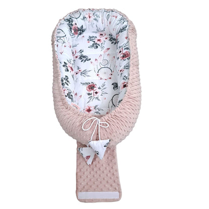 Evcushy newborn baby nest in pastel pink – breathable, comfy sleep pod with liner for 0–9 months.