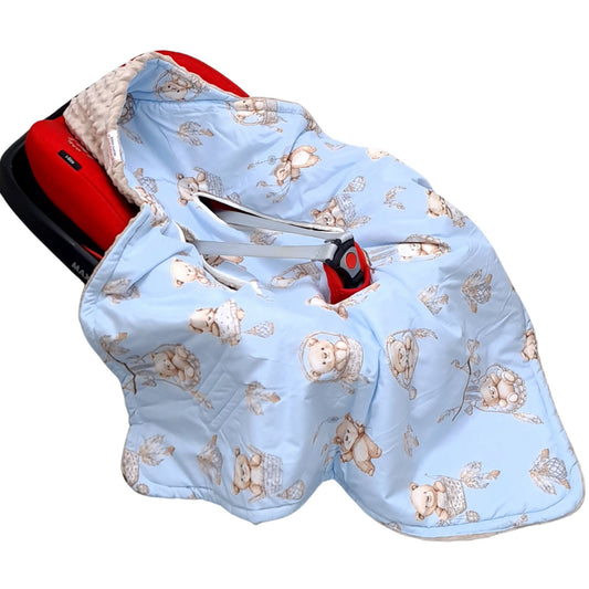 A light blue baby car seat handmade cover featuring a repeating teddy bear pattern, shown fitted over a red car seat against a white background.