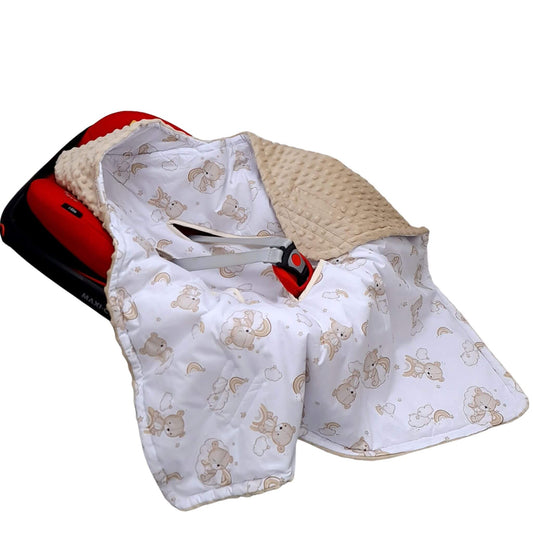 A baby car seat blanket with a white background, printed with a beige cartoon animal teddy bear pattern, featuring a textured beige knit reverse side and a red-and-black car seat insert visible underneath.