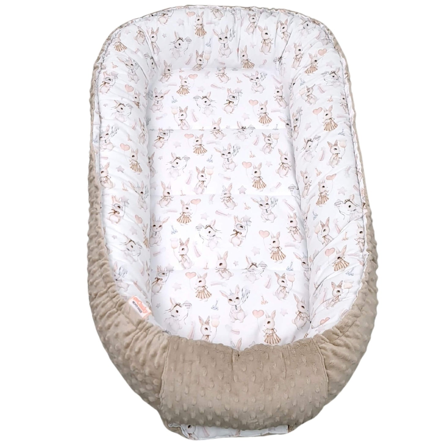Top view of the Blush Bunny XXL baby nest with mocha bottom and bunny pattern on white cotton