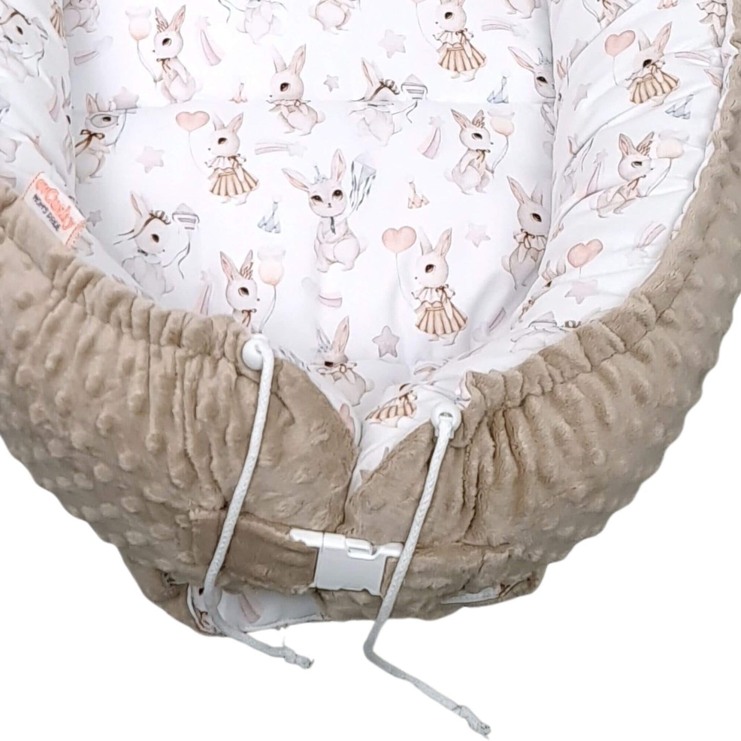 Side view of XXL Blush Bunny baby nest showing adjustable buckle and drawstrings