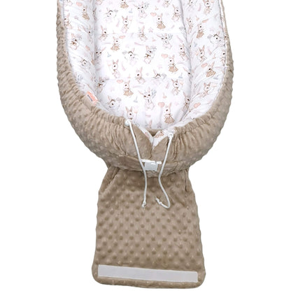 Close-up of Blush Bunny baby pod fabric showing bunnies holding heart balloons and stars