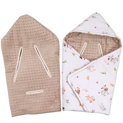 A baby swaddle travel blanket shown in two views: one flat view of the beige dotted minky fabric with 5 points harness openings, and one folded view of the white fabric with a farm animal print and hood.