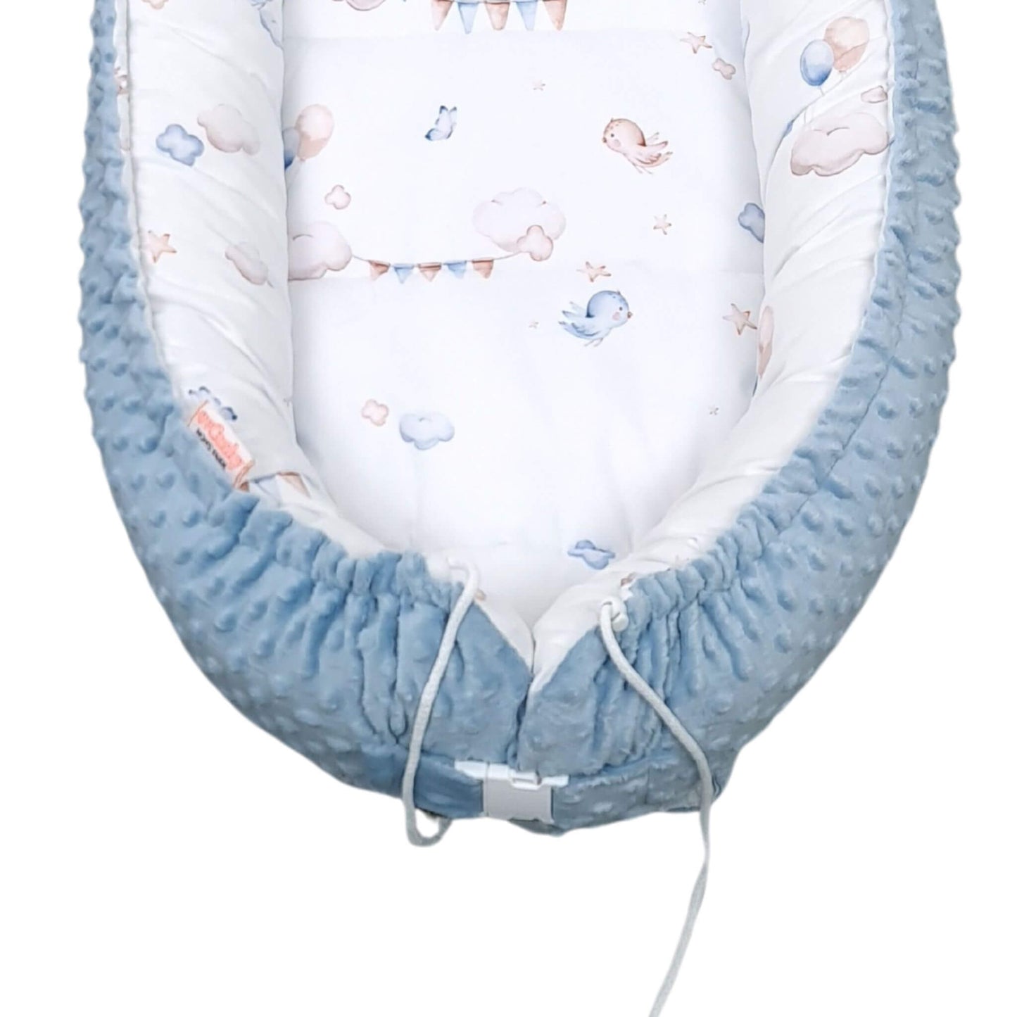 Close-up of blue dimple plush bottom of toddler nest, buckle closure 