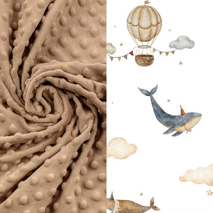 Textured beige bedding with a hot air balloon, whale, and clouds illustration on a white cotton for toddler in ireland