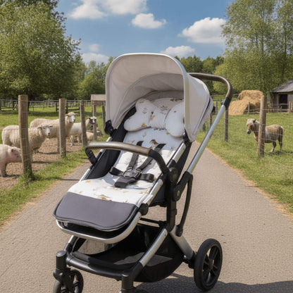 Evcushy Farm Animals reversible stroller liner with matching head support pillow fitted inside a buggy. Soft padded cotton and velvet pram liner with washable footrest.