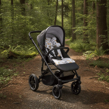 Evcushy Forest reversible stroller liner with matching head support pillow fitted inside a buggy. Soft padded cotton and velvet pram liner with washable footrest.