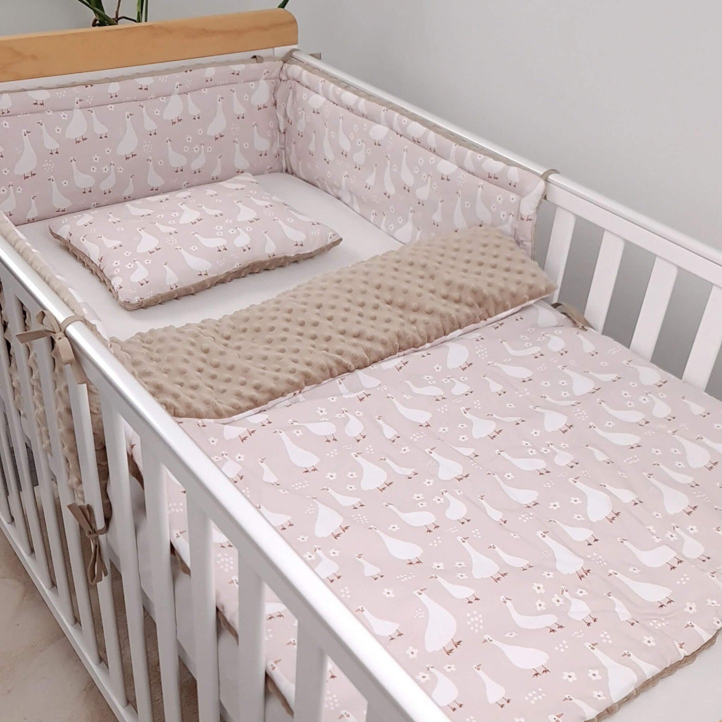 Evcushy Geese Family baby bedding set in a cot featuring soft cotton fabric and plush minky, including quilt and pillow for newborn babies.
