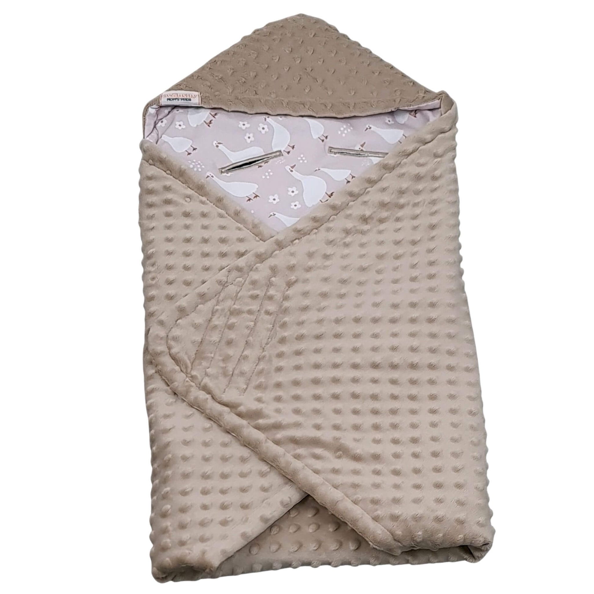 Folded blanket for infants car seat showing geese pattern and mocha plush reverse