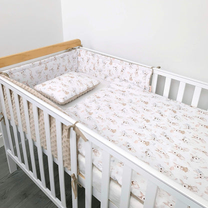 Retro Bunny cot bumper and bedding for baby girl styled in baby cot in minimalistic white nursery