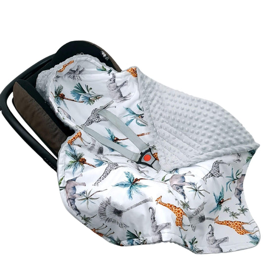 Close-up of safari animal cotton fabric showing elephants, giraffes, rhinos, and palm trees from Evcushy Safari Adventure blanket for newborns