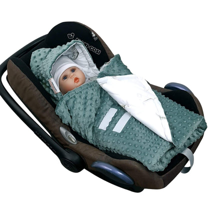 Close-up of Evcushy Tiny Roars car seat blanket with Velcro fastening for easy baby wrapping