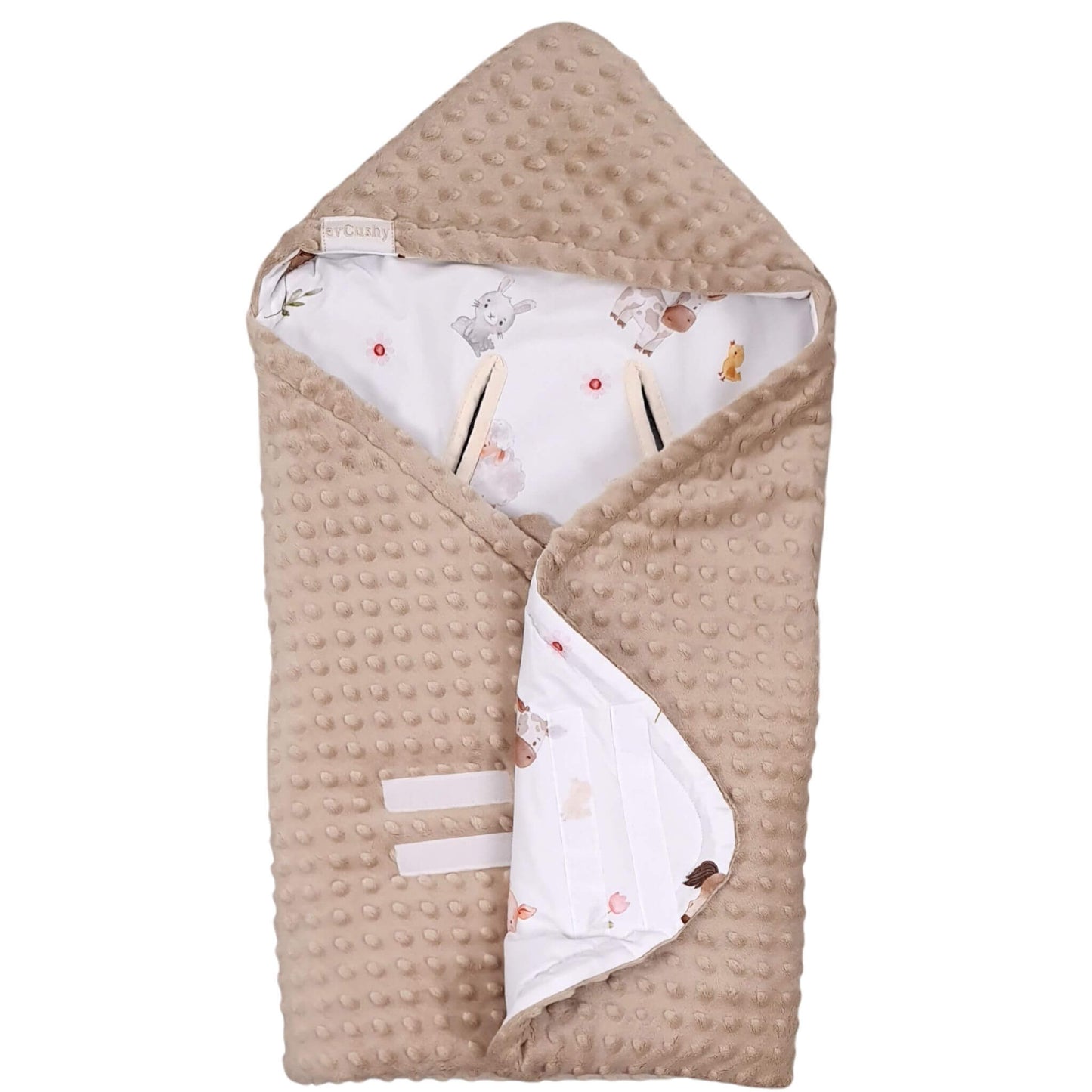 cosy blanket for children in the car seat and stroller, warm beige colour minky textured fabric and white cotton with farm animals on the reverse side shown velcro fastening 