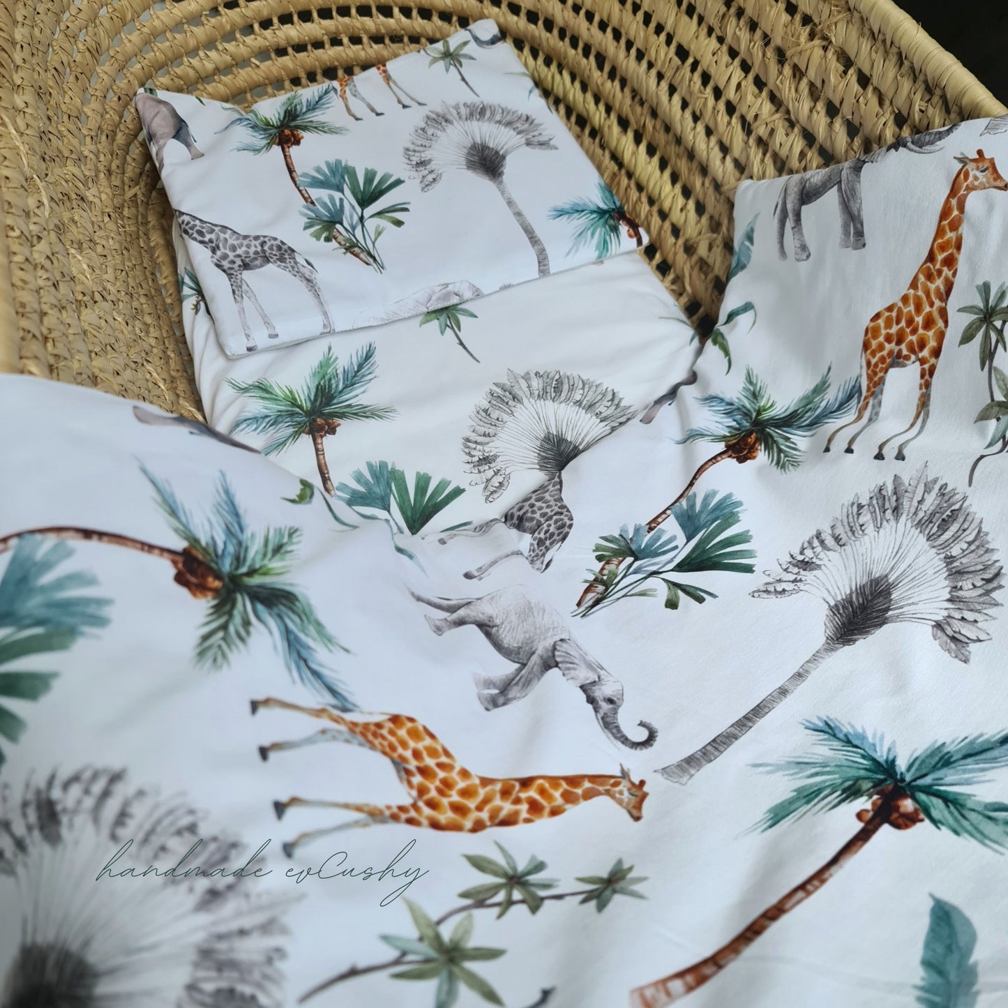 "Image of a newborn set with a charming grey and safari patterned cotton quilt and pillow, enhanced with luxuriously soft velvet for ultimate comfort." fits moses basket