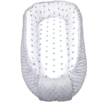 Grey stars baby nest with plush grey minky fabric used as a cosy baby lounger on the floor – handmade newborn nest by Evcushy