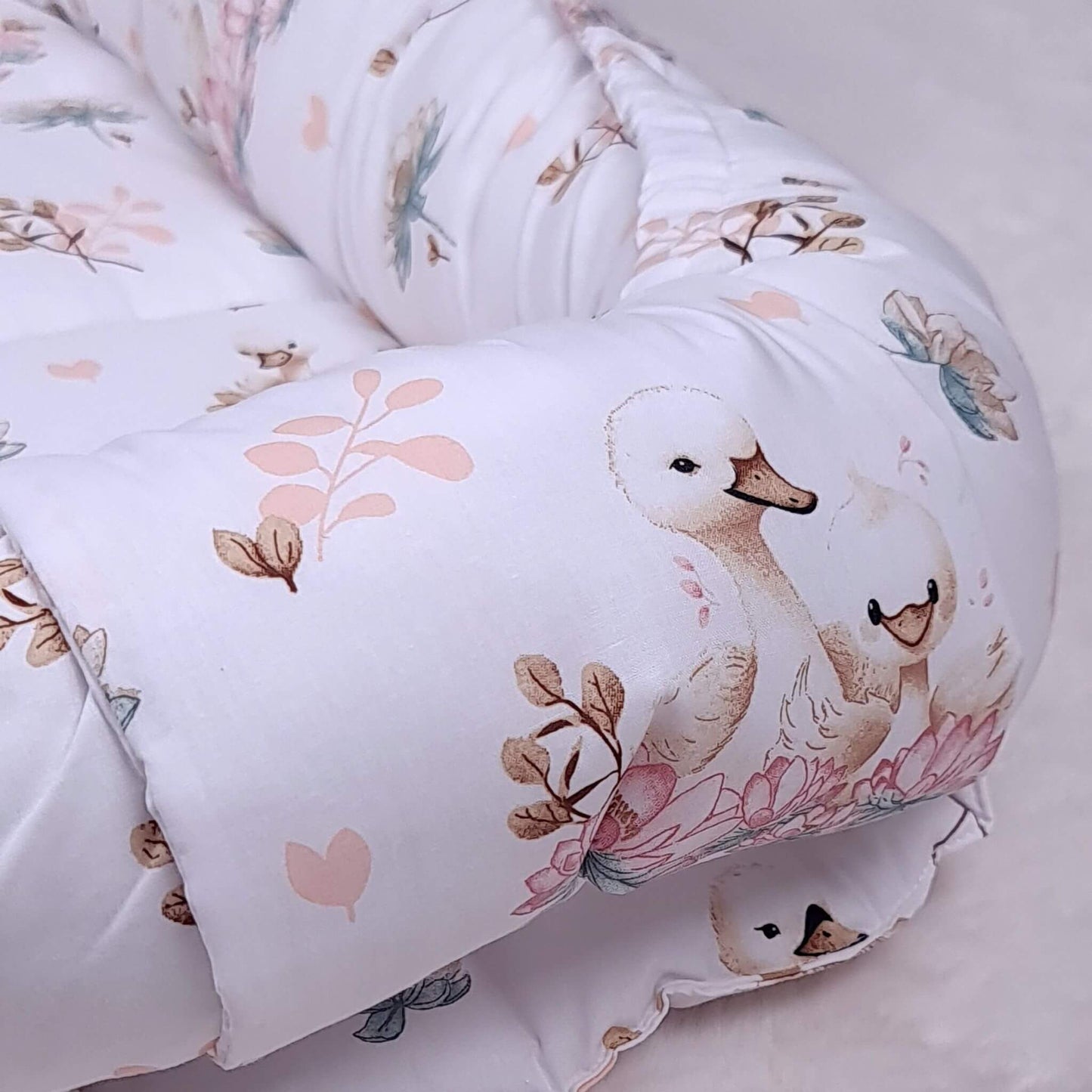 Baby lounger nest with swans pattern for safe sleep all cords hidde with the band