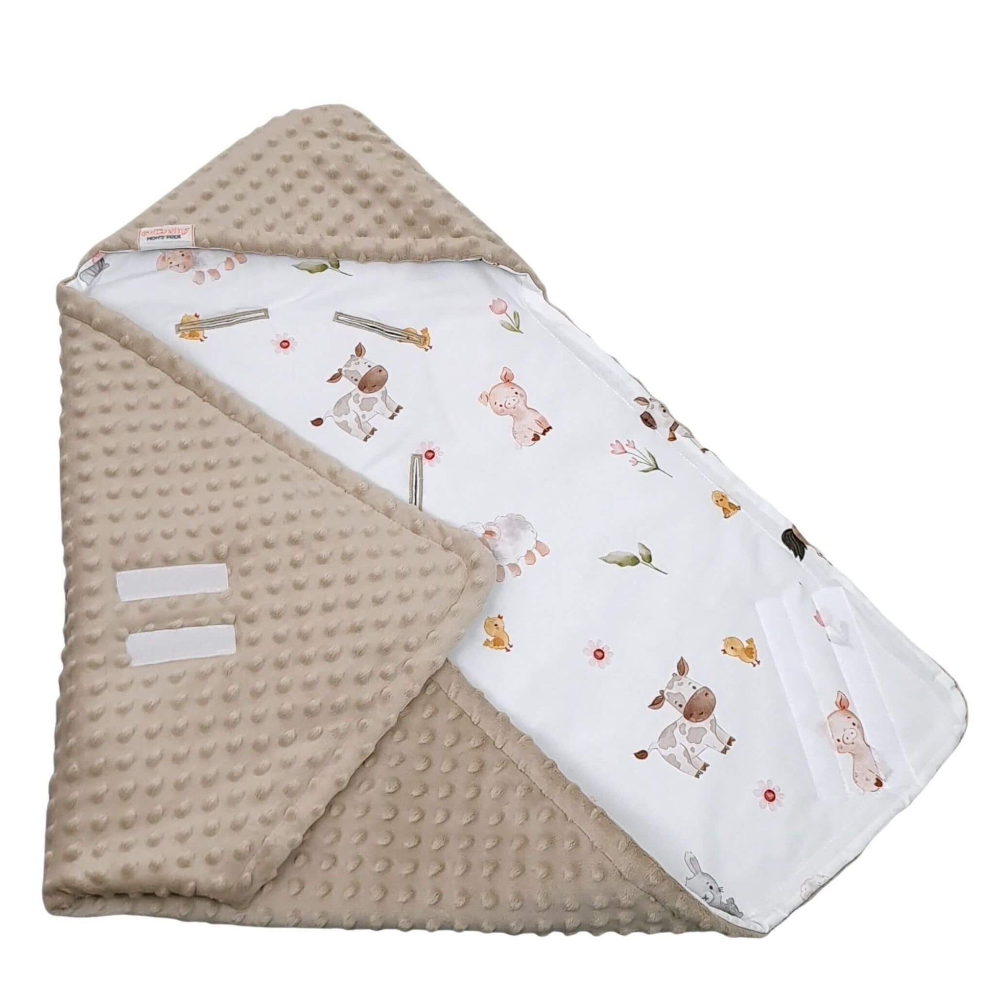 Folded view showing car seat blanket for newborn with farm animals pattern and mocha minky reverse 