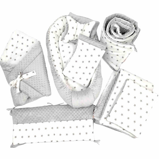 newborn baby bundle neutral colours white and grey stars cot bedding set baby nest swadling blanket cot bumper and cot organizer