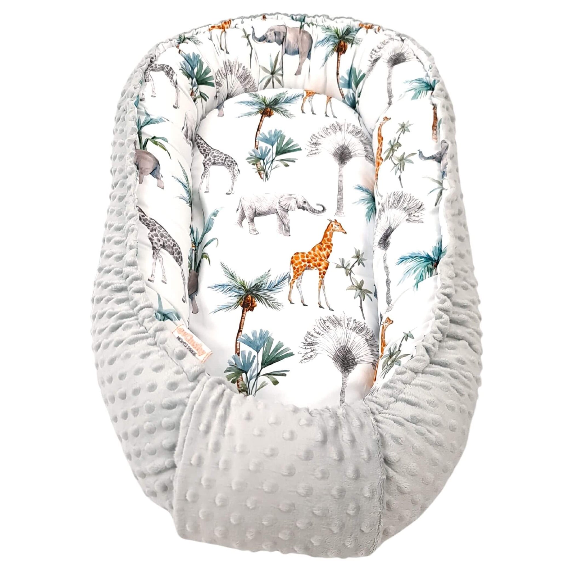 evCushy Baby Nest – Safari Adventure side featuring elephants, giraffes, and rhinos among palm trees