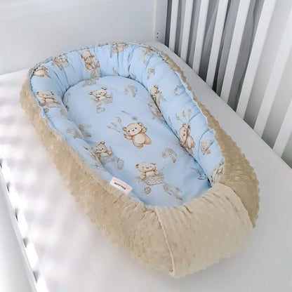 side of the baby lounger showcasing reversible design for newborn