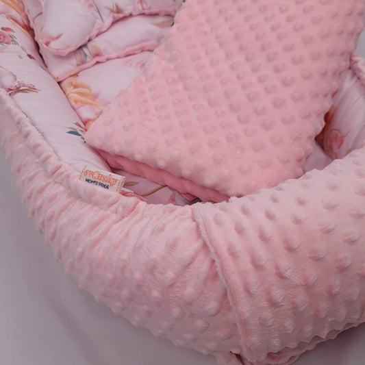 Close up of ultra soft soothing plush minky and premium cotton baby nest fabric
