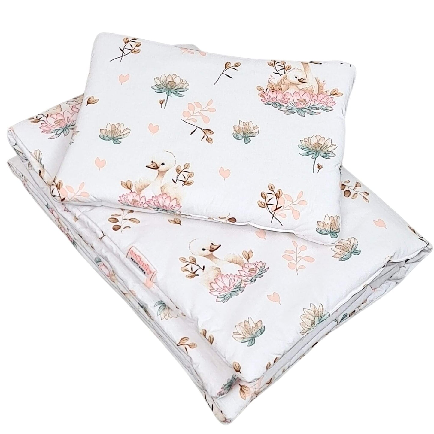 Baby bedding set with elegant swans and soft lotus flower pattern in neutral nursery colours